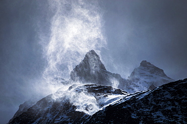 Wind sweeping snow off mountains, Torres del Paine National Park, Patagonia, Chile, South America