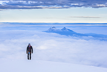 Climber on final 20m to the 5897m summit of Cotopaxi Volcano, Cotopaxi Province, Ecuador, South America