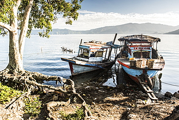 Old rusty fishing boats in a village at Lake Toba (Danau Toba), North Sumatra, Indonesia, Southeast Asia, Asia