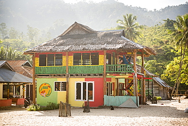 Rasta (Rastafarian) coloured beachfront accommodation at Sungai Pinang, near Padang in West Sumatra, Indonesia, Southeast Asia, Asia