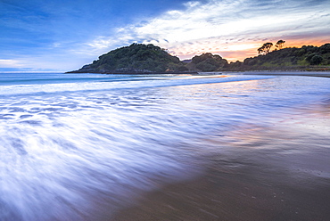 Sunrise at Maitai Bay (aka Matai Bay), a popular beach on the Karikari Peninsula, Northland, New Zealand, Pacific