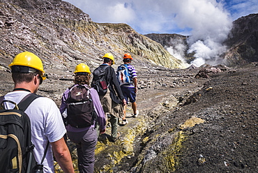 Tourists exploring White Island Volcano, an active volcano in the Bay of Plenty, North Island, New Zealand, Pacific