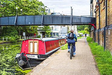 Cycling by the Canal at Ladbroke Grove in the Royal Borough of Kensington and Chelsea, London, England, United Kingdom, Europe