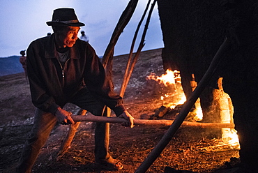 Brick workers firing a kiln near Antsirabe, Vakinankaratra Region, Madagascar, Africa