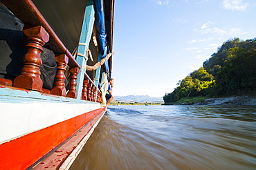 Tourist on the side of the slow boat from Thailand to Vientiane, Laos, Indochina, Southeast Asia, Asia