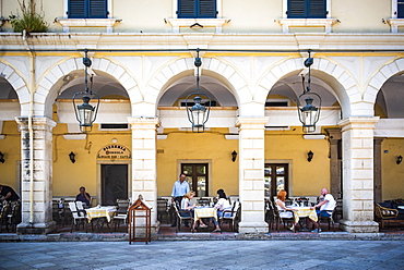 People dining under arches at restaurant in old town of Corfu, Corfu Island, Ionian Islands, Greece, Europe