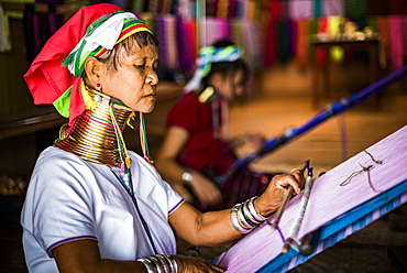 Long necked woman from Padaung tribe weaving at Inle Lake, Shan State, Myanmar (Burma), Asia