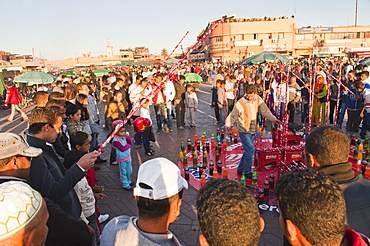 Moroccans playing games in Place Djemaa El Fna, Marrakech, Morocco, North Africa, Africa 