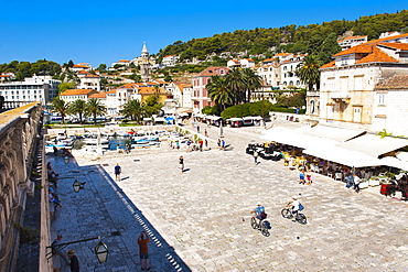 Cafes and tourists in St. Stephens Square, Hvar Town, Hvar Island, Dalmatian Coast, Croatia, Europe 