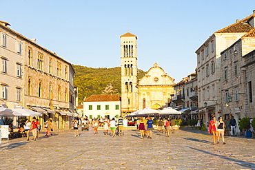 Tourists on holiday in St. Stephens Square, Hvar Town, Hvar Island, Dalmatian Coast, Croatia, Europe