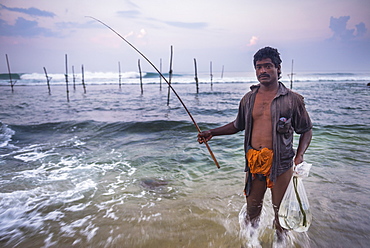 Stilt fisherman at Midigama near Weligama, South Coast, Sri Lanka, Indian Ocean, Asia 