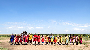 Masai Mara members sing tribal songs to greet guests to their village, Masai Mara National Reserve, Kenya, East Africa, Africa