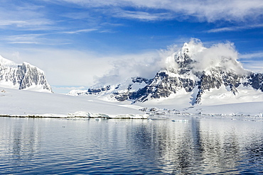 Snow-capped mountains surround Mickelson Harbor, Antarctica, Southern Ocean, Polar Regions