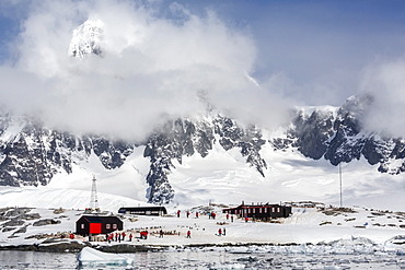 Snow-capped mountains surround Port Lockroy, Antarctica, Southern Ocean, Polar Regions