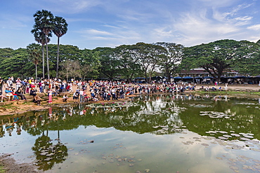 Sunrise over tourists gathered at Angkor Wat, Angkor, UNESCO World Heritage Site, Siem Reap Province, Cambodia, Indochina, Southeast Asia, Asia