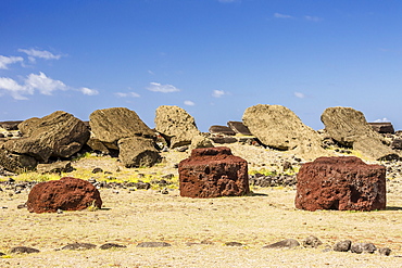 Fallen moai and red scoria topknots at Ura Uranga Te Mahina ceremonial site on Easter Island (Isla de Pascua) (Rapa Nui), UNESCO World Heritage Site, Chile, South America