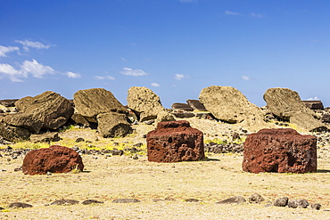 Fallen moai and red scoria topknots at Ura Uranga Te Mahina ceremonial site on Easter Island (Isla de Pascua) (Rapa Nui), UNESCO World Heritage Site, Chile, South America 