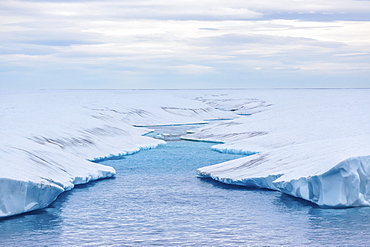 Melt water stream in tabular iceberg in Isabella Bay, Baffin Island, Nunavut, Canada, North America