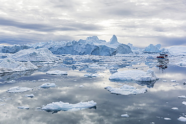 A commercial iceberg tour amongst huge icebergs calved from the Ilulissat Glacier, UNESCO World Heritage Site, Ilulissat, Greenland, Polar Regions