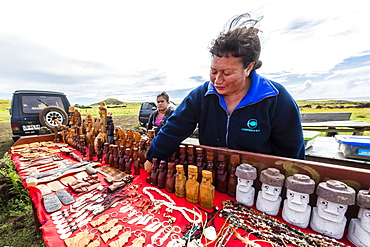 Local woman selling hand crafts at Ahu Akahanga on Easter Island (Isla de Pascua), Rapa Nui, Chile, South America