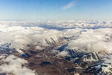 Aerial view of mountains, glaciers and ice fields on the west coast of Spitsbergen on a commercial flight from Longyearbyen to Oslo, Svalbard, Norway, Scandinavia, Europe