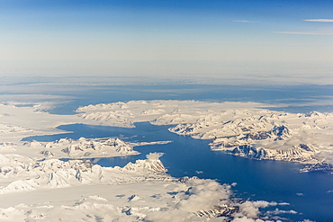 Aerial view of mountains, glaciers and ice fields on the west coast of Spitsbergen on a commercial flight from Longyearbyen to Oslo, Svalbard, Norway, Scandinavia, Europe