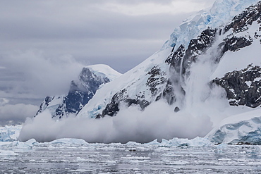 Falling avalanche of snow and ice in Neko Harbor, Antarctica, Polar Regions