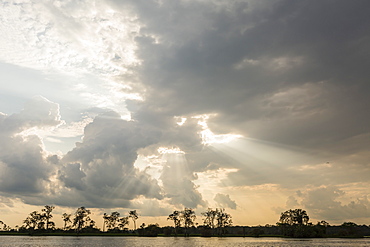 Sunburst through clouds on the Pacaya River, Upper Amazon River Basin, Loreto, Peru, South America