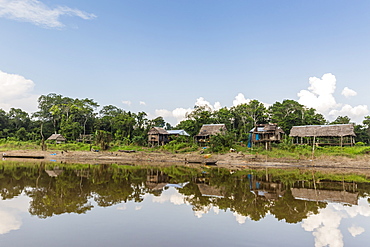 Village on the banks of the El Dorado, Upper Amazon River Basin, Loreto, Peru, South America