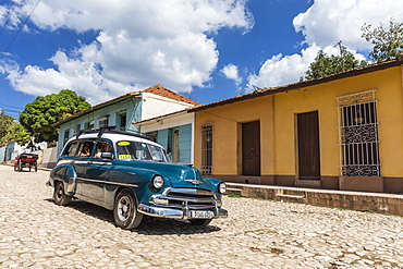 A vintage 1950's American car working as a taxi in the town of Trinidad, UNESCO World Heritage Site, Cuba, West Indies, Caribbean, Central America