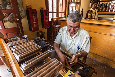 Hand rolling Cuban cigars in the UNESCO World Heritage Site city of Trinidad, Cuba, West Indies, Caribbean, Central America