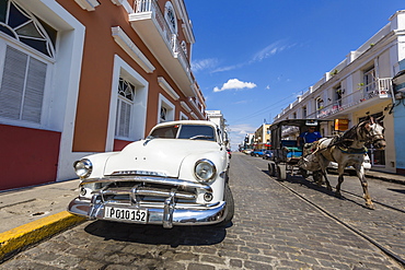 Classic 1950's Plymouth taxi, locally known as almendrones in the town of Cienfuegos, Cuba, West Indies, Caribbean, Central America