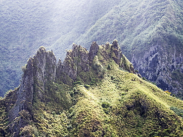 Interesting volcanic rock formations surrounding the town of Hanavave, Fatu Hiva, Marquesas, French Polynesia, South Pacific, Pacific