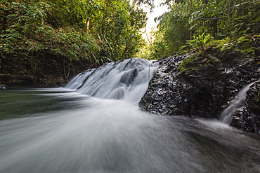 Slow motion blur of waterfall in Corcovado National Park, Osa Peninsula, Costa Rica, Central America