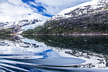 Reflections in calm water in the Strait of Magellan, Patagonia, Chile, South America