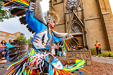 Santa Fe Indian Market participants in traditional regalia perform in downtown Santa Fe, New Mexico, United States of America, North America