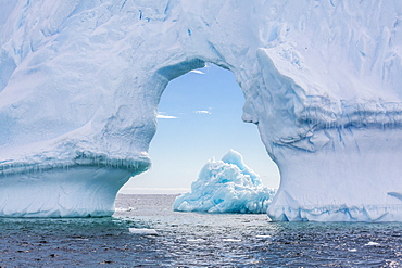 Huge arched iceberg near Petermann Island, western side of the Antarctic Peninsula, Southern Ocean, Polar Regions