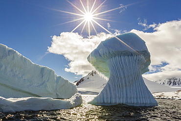 Huge mushroom shaped iceberg in Dorian Bay, western side of the Antarctic Peninsula, Southern Ocean, Polar Regions