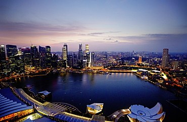 View over Marina Bay to skyline at night, Downtown core, Singapore