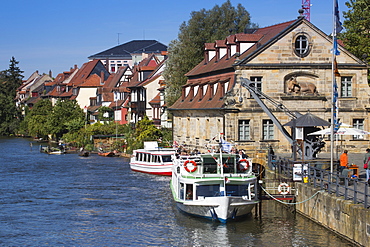 Sightseeing boat Christl and buildings of Klein Venedig Little Venice district alongside the left branch of the Regnitz river, Bamberg, Franconia, Bavaria, Germany