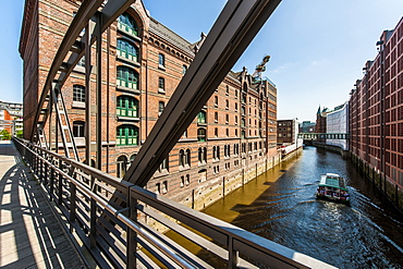 Excursion boat passing Speicherstadt, Hamburg, Germany