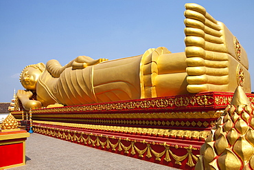 Golden Buddha at Pha That Luang Monument in Vientiane, capital of Laos, Asia