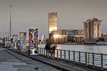 Sections of the Berlin wall in Friedrichshain, river Spree, Treptowers, Allianz building, Molecule man, Friedrichshain, Berlin, Germany