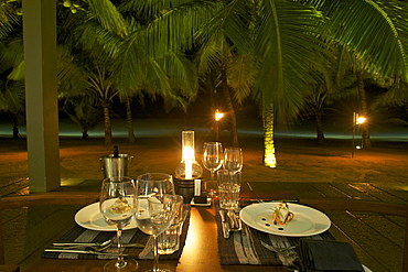 Candlelight dinner on the beach with palm trees at Hotel Jetwing Blue, Negombo, Sri Lanka