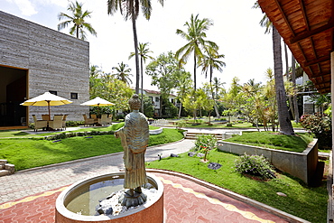 Fountain with Buddha statue in front of a hotel spa, Mysore, Karnataka, India