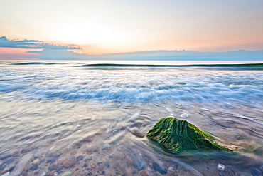 Stone on the beach in the evening light, Baltic Sea, Nienhagen, Mecklenburg-Vorpommern, Germany