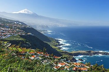 View from El Sauzal to Teide, 3718m, with snow, the islandÂ´s landmark, highest point in Spain, volcanic mountain, coastline, Atlantic ocean, Tenerife, Canary Islands, Spain, Europe