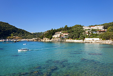 Excursion boat at Alipa Bay, Paleokastritsa, Corfu island, Ionian islands, Greece