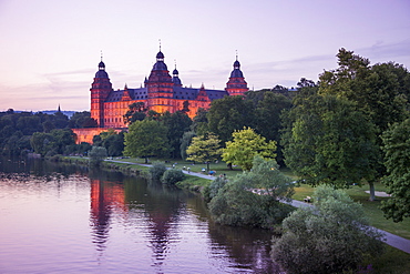 Johannisburg Palace and parklands along the Main river at dusk, Aschaffenburg, Franconia, Bavaria, Germany