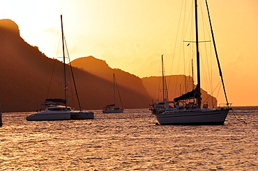 sailing ships at sunset anchoring at Bequia island, sea, St. Vincent, Saint Vincent and the Grenadines, Lesser Antilles, West Indies, Windward Islands, Antilles, Caribbean, Central America